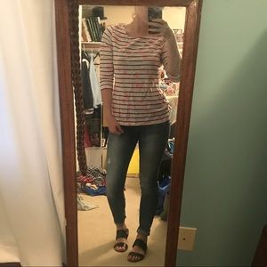 White shirt with black stripes and pink floral